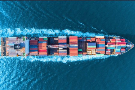 Aerial view full speed container ship