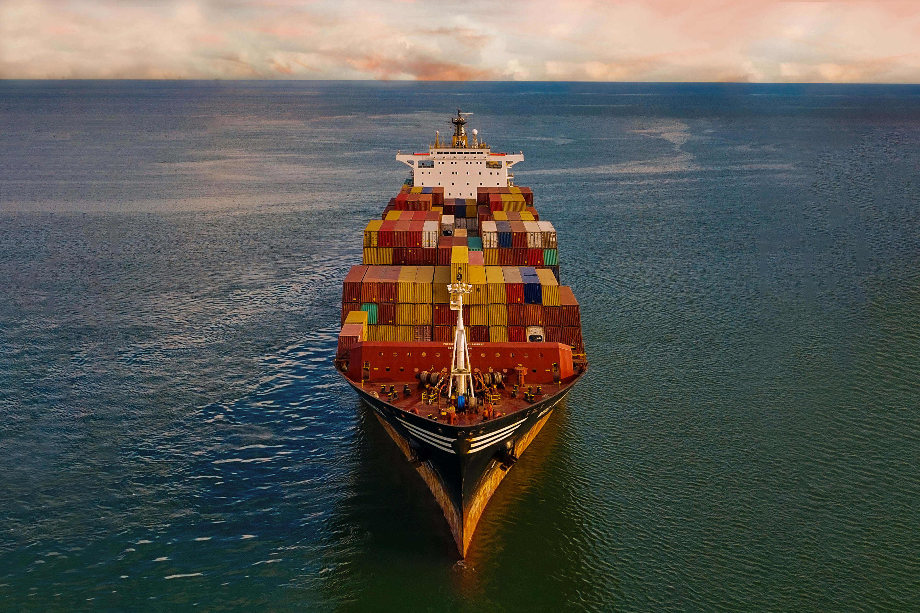 Aerial view of Container freight ship in transit.