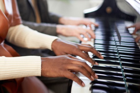 Musicians playing piano duet