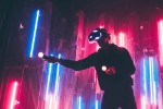 Man wearing vr headset in dark space with neon light lamps
