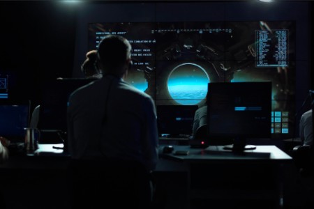 People working in mission control center