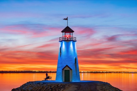 Beautiful sunset of the lake hefner lighthouse