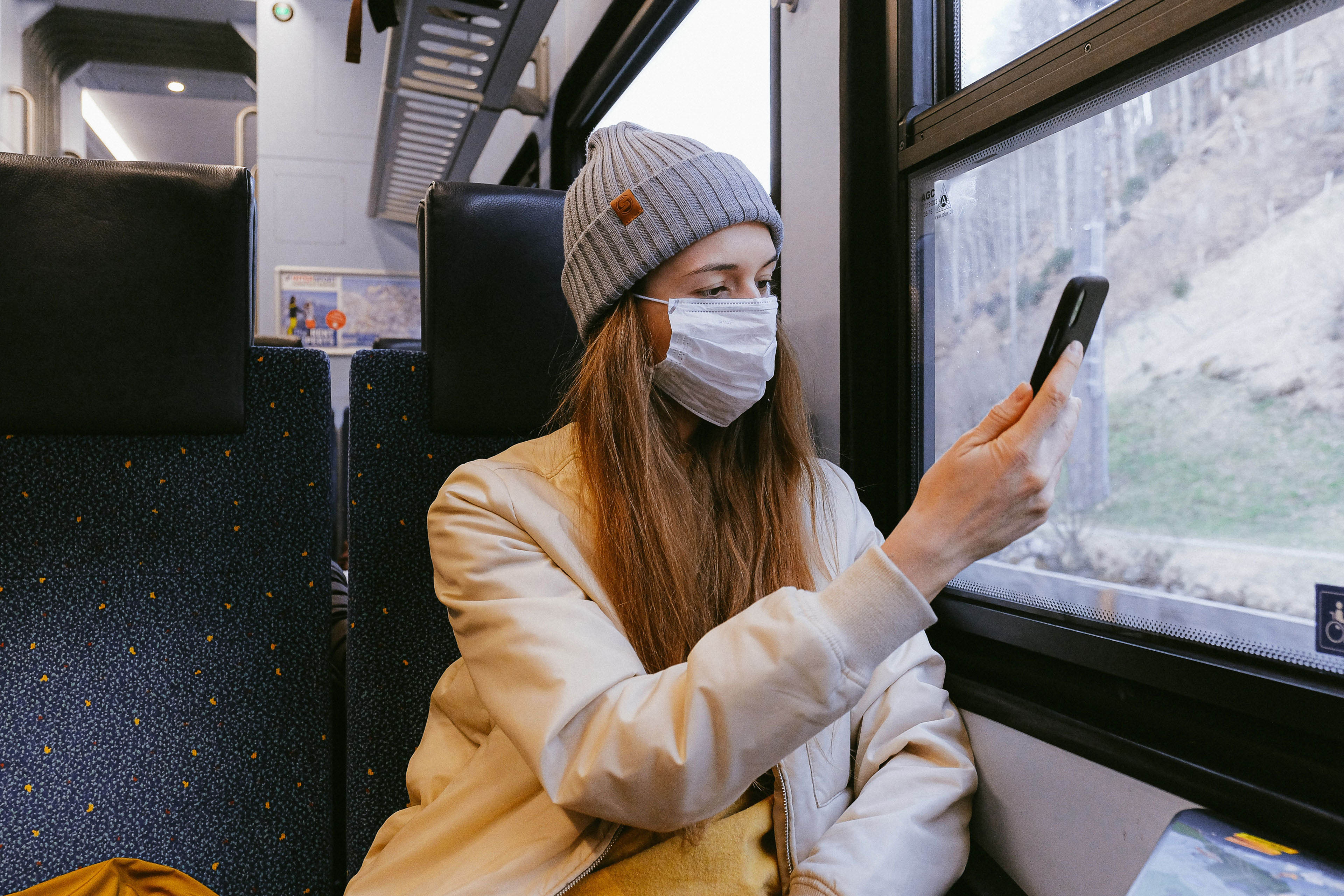Woman on train covid mask