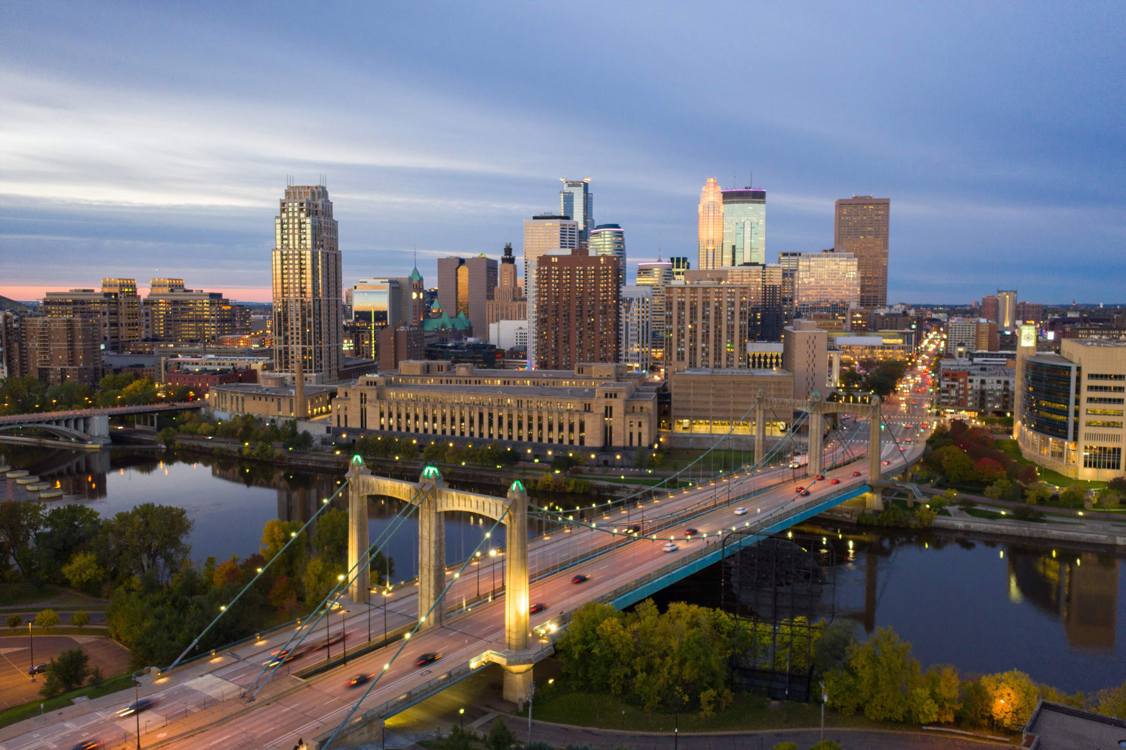 Minneapolis skyline and Hennepin bridge at sunrise