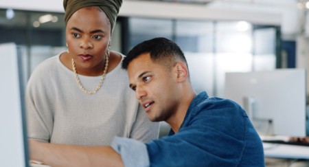 Discussion with a man and woman employee talking in their modern work office