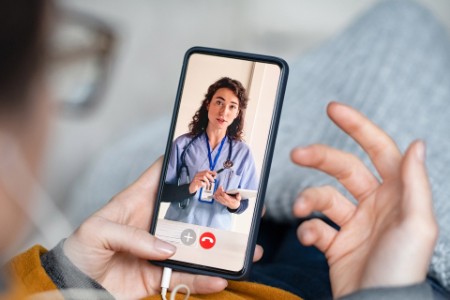 Woman on video call with doctor