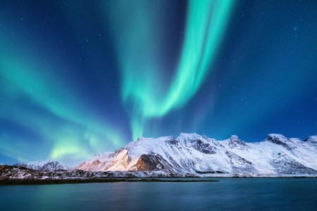 Northen light under mountains. Beautiful natural landscape in the Norway