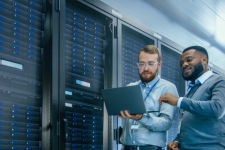 EY - Two colleagues working on server