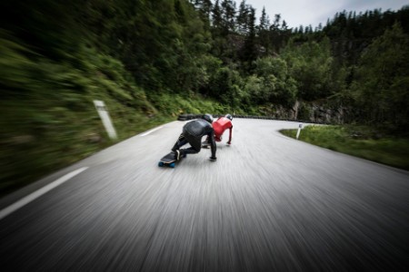 ey-longboarders-chasing-down-a-road-in-norway