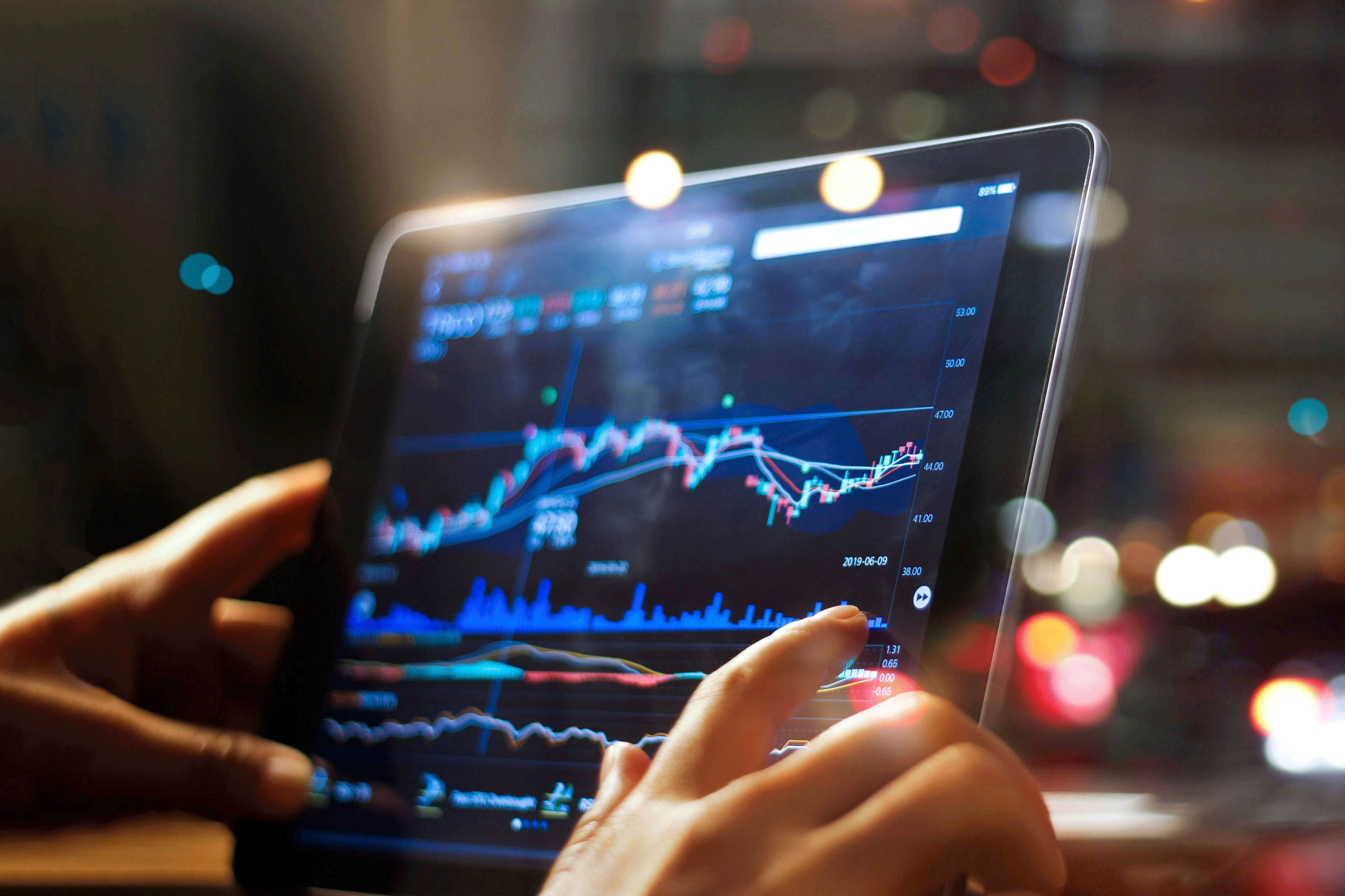 ey-businessman-checking-stock-market-data-on-tablet