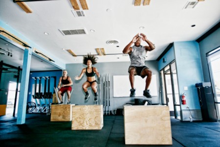 Women and men training at crossfit gym