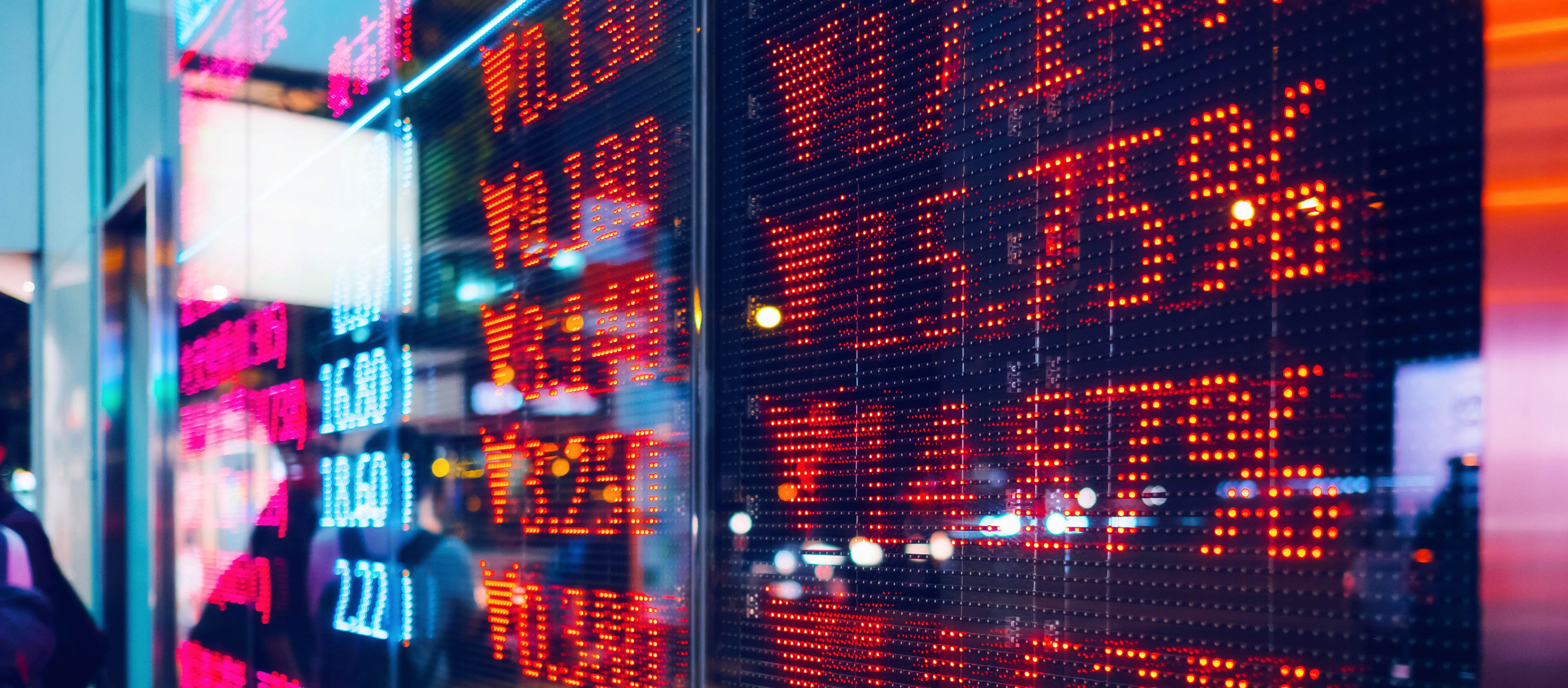Stock exchange market display screen board showing stock market state in red