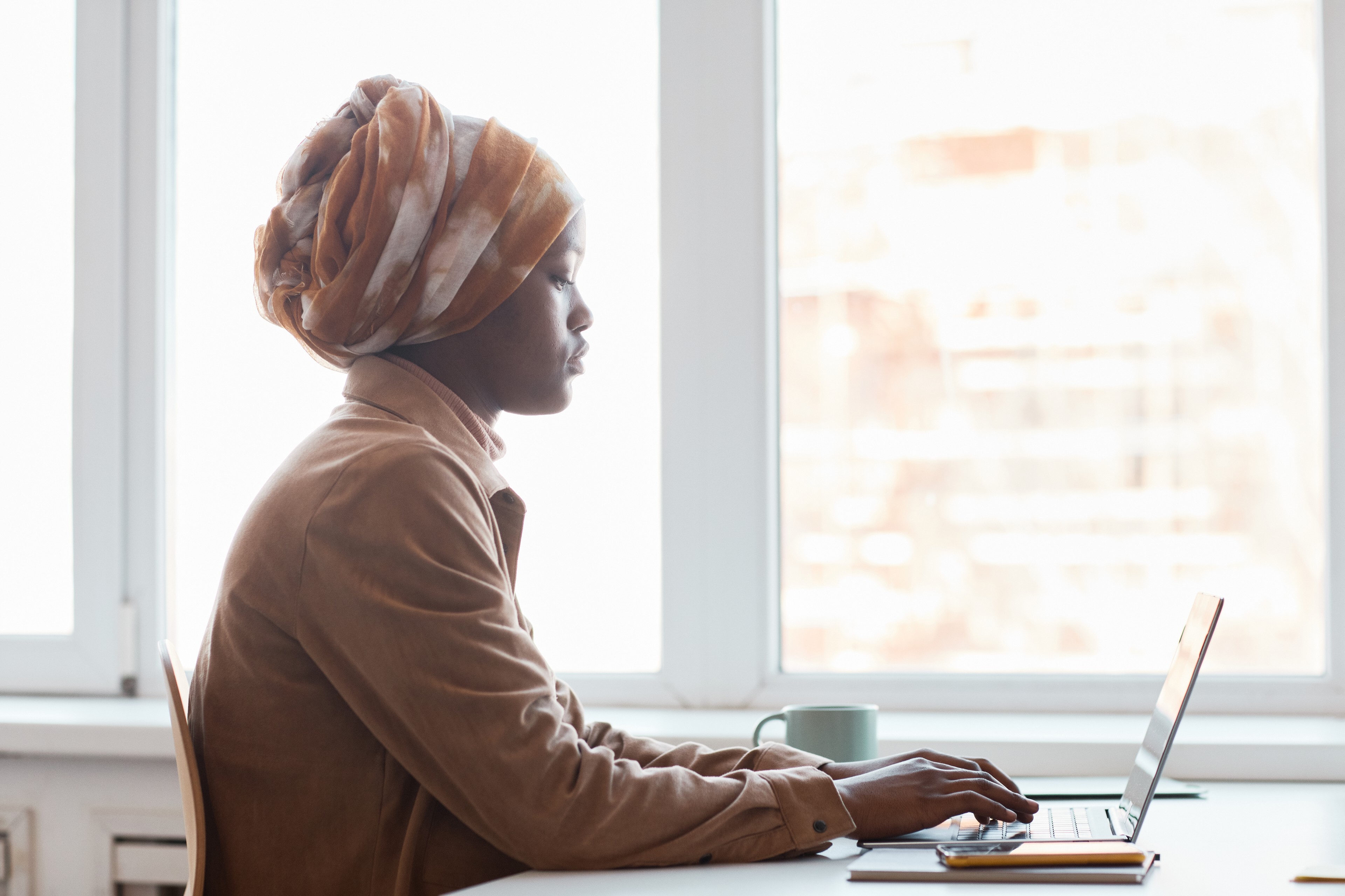 Young African American Businesswoman Working Side View
