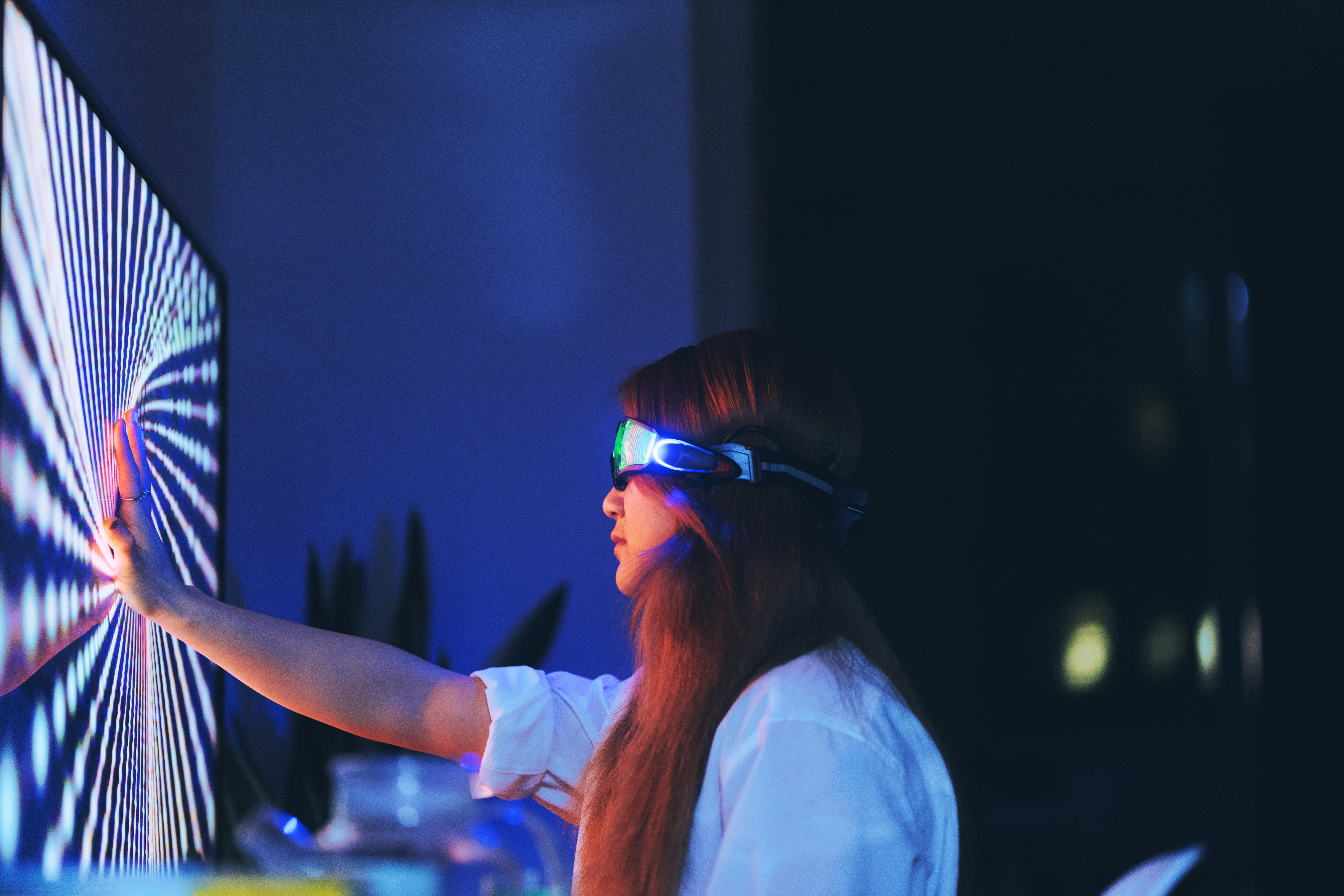 woman wearing augmented reality glasses touching screen
