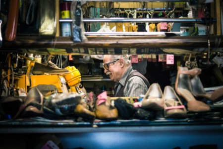 Senior man repairing shoes