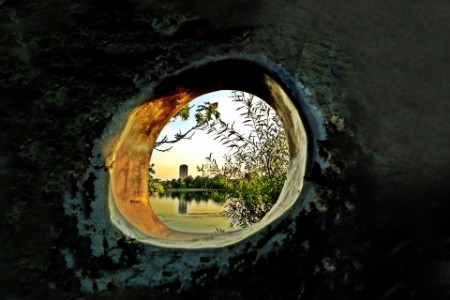 The calm lake seen through wall hole