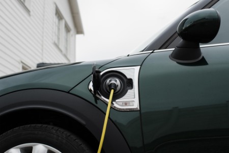 Electric car plugged into charging