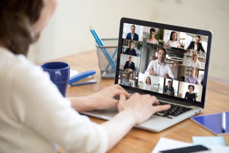 Laptop screen view diverse businesspeople involved at group videocall